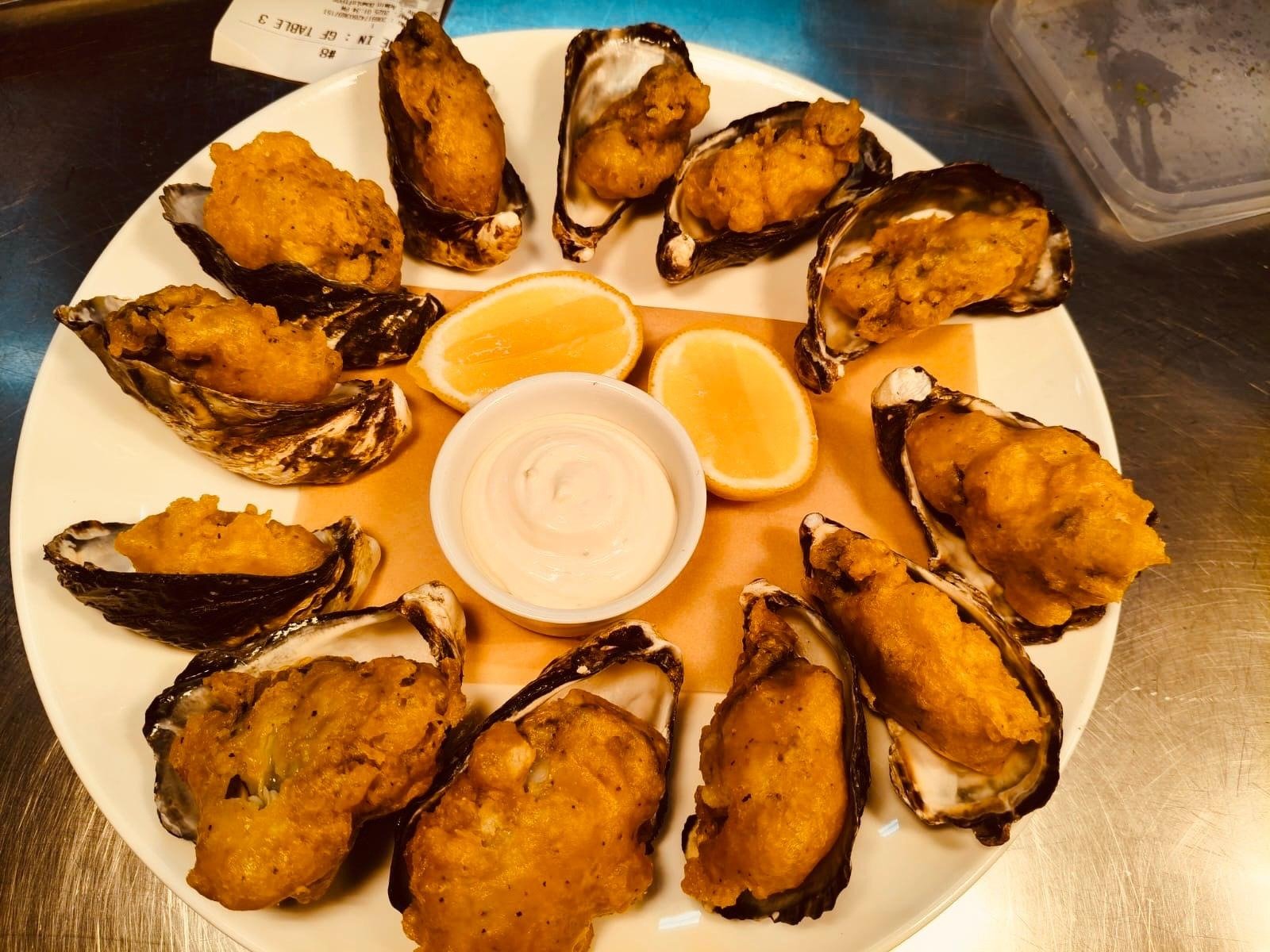 Crumbed oysters with lemon